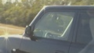Driver Reading a Book, Kindle, and Phone at the Same Time Is a Distracted Super-Moron